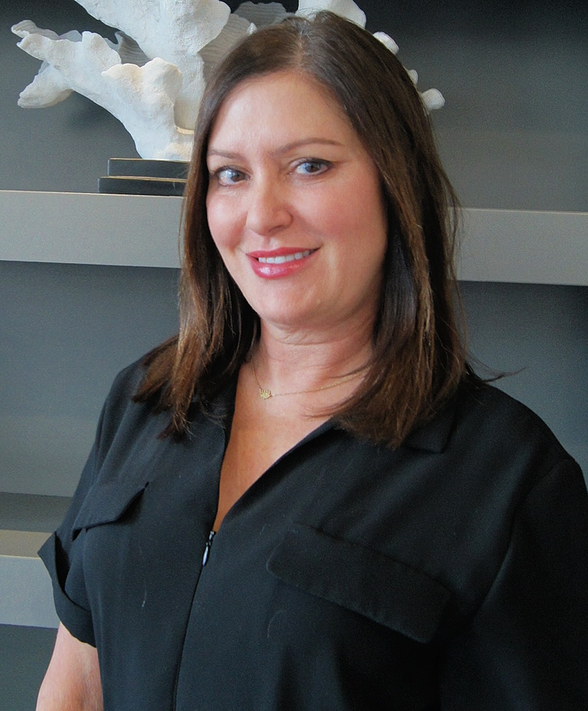 Professional woman smiling in modern office setting