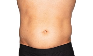 Person's bare abdomen with no visible markings.