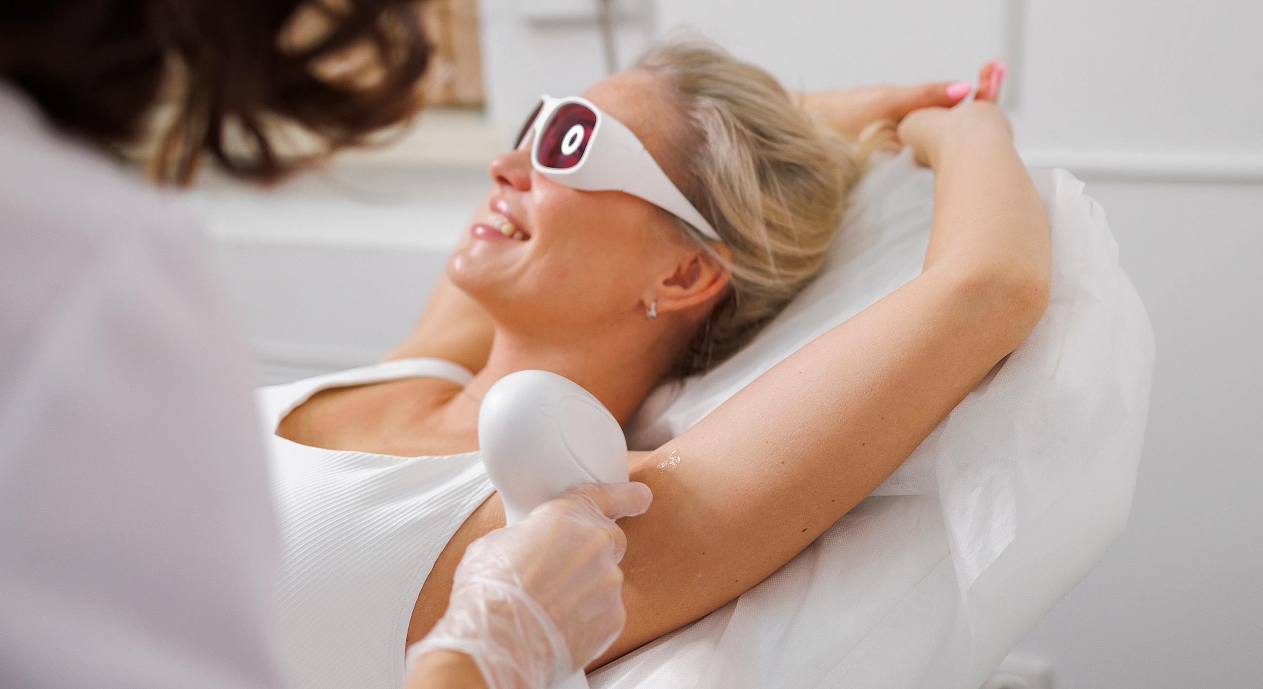 Laser hair removal treatment in progress.