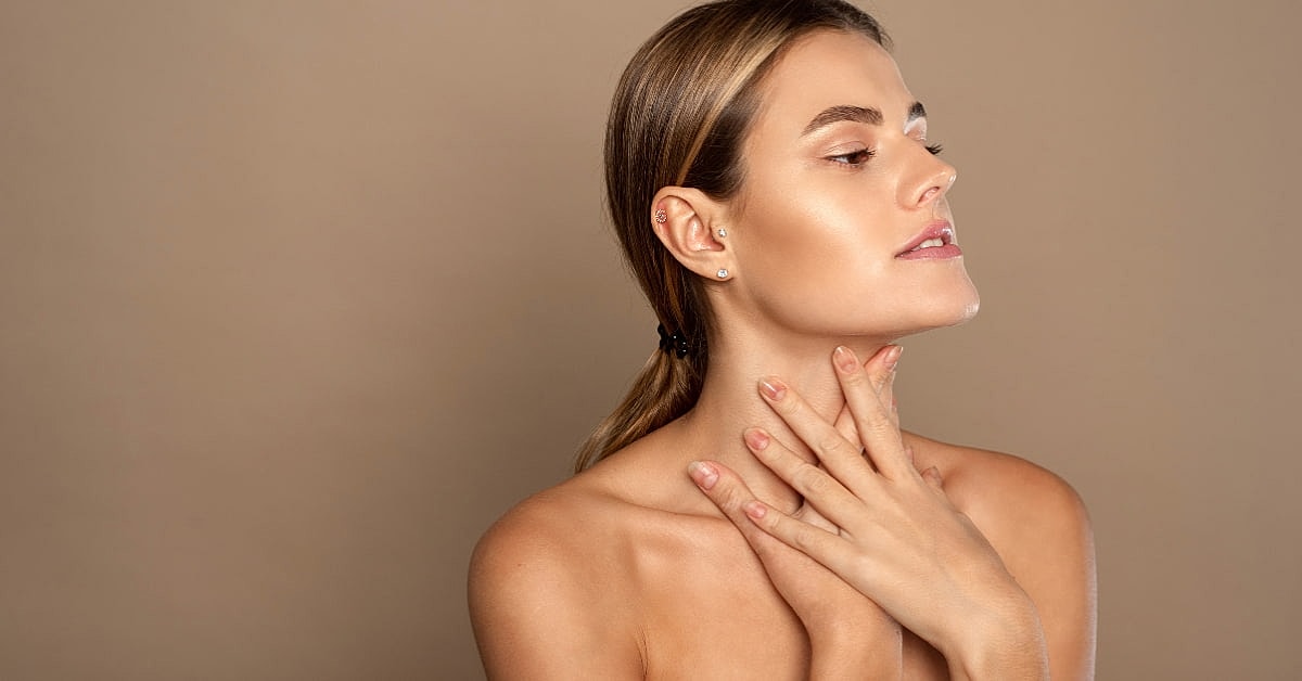 Woman with natural makeup and elegant pose.