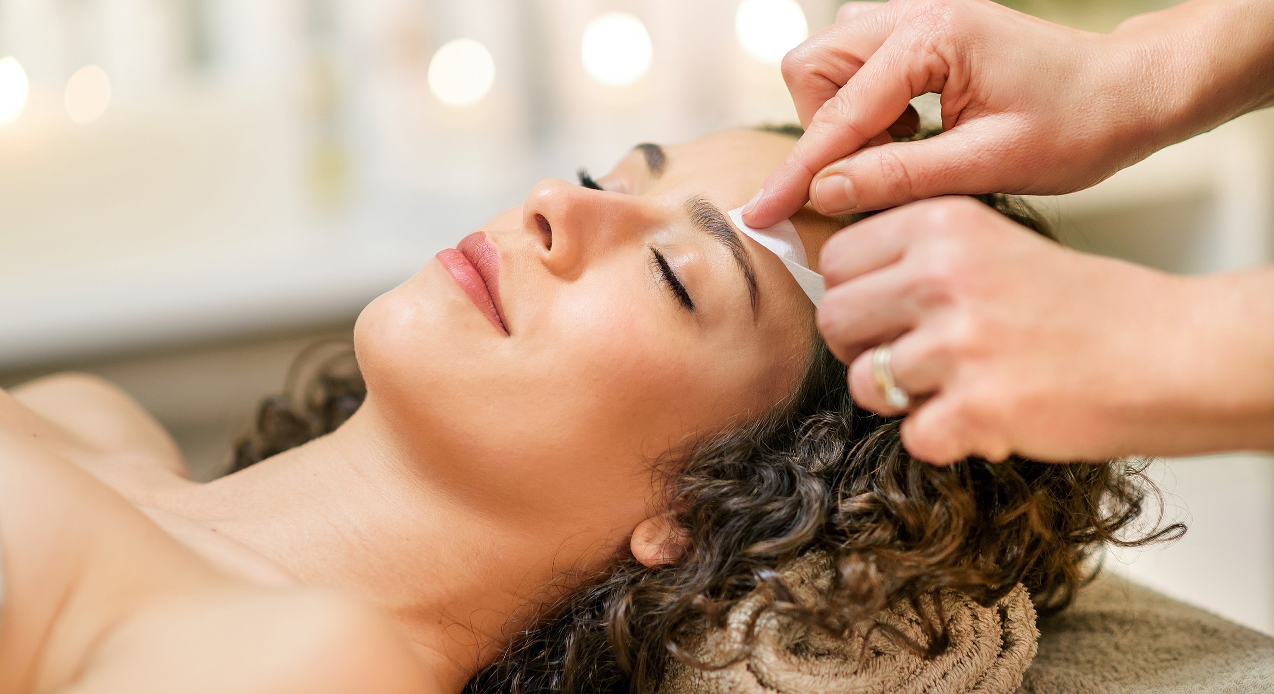 Waxing treatment on a woman's leg.
