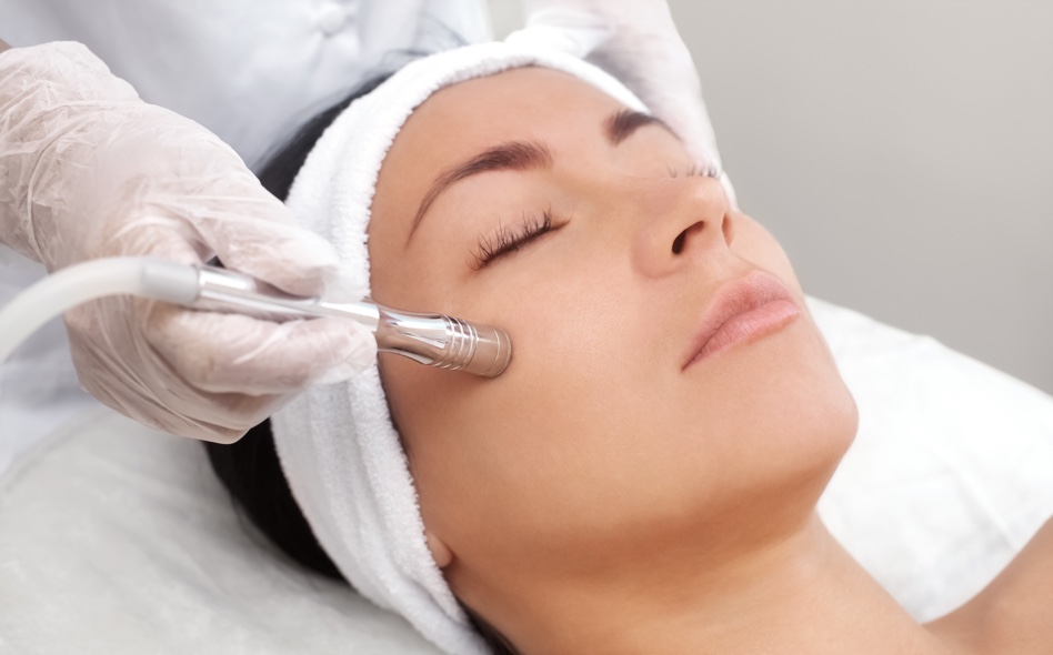 Woman receiving treatment from an aesthetician