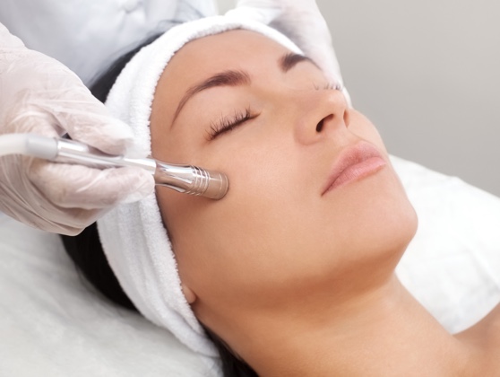 Woman receiving treatment from an aesthetician