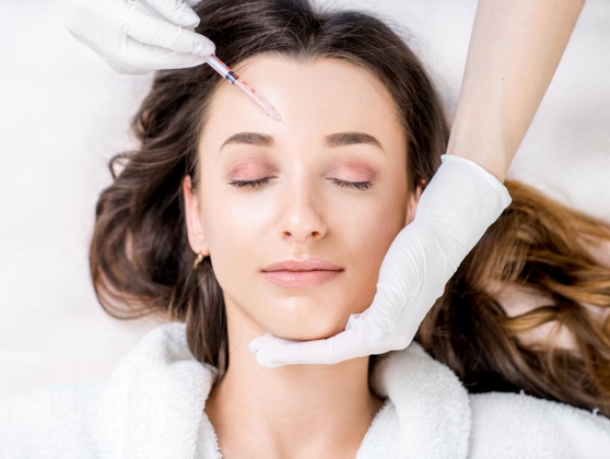 Woman receiving botox injections from a certified injector