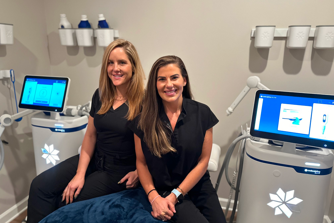 Woman receiving CoolSculpting treatment on her abdomen